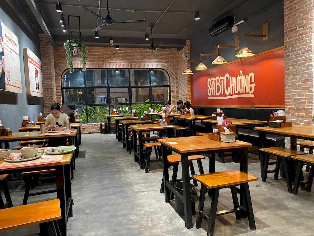 The space offers a modern, youthful vibe with warm tones and minimalist furnishings that feel both fresh and welcoming